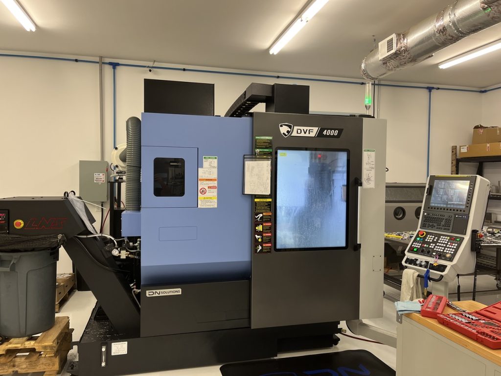Why do Customers prefer using DN Solutions DVF 4000 CNC 5-Axis Vertical Machining Center that is solution for complex shapes made in South of Korea?