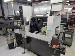 Tsugami SS32 CNC Swiss Lathe with FMB Barfeeder – Year 2010
