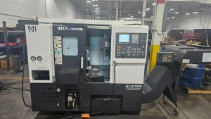 Hyundai Wia SE2000PA CNC Lathe with EDGE Technologies Rebel V-65 Servo Bar Feeder/Loader + Parts Catcher – Year 2019