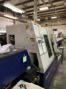 Tornos Evo Deco 16/10 CNC Swiss Screw Machine with ROBOBAR SBF 216 EVO Bar Feeder – Year 2012