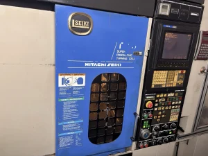 Hitachi Seiki TF20 CNC Lathe With MR6 Robot Loader and Turnover Station – Year 1995